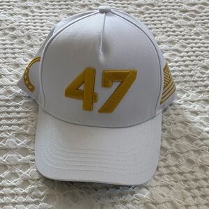 White 47 TPUSA Cap with Yellow/Gold Flag Embroidery